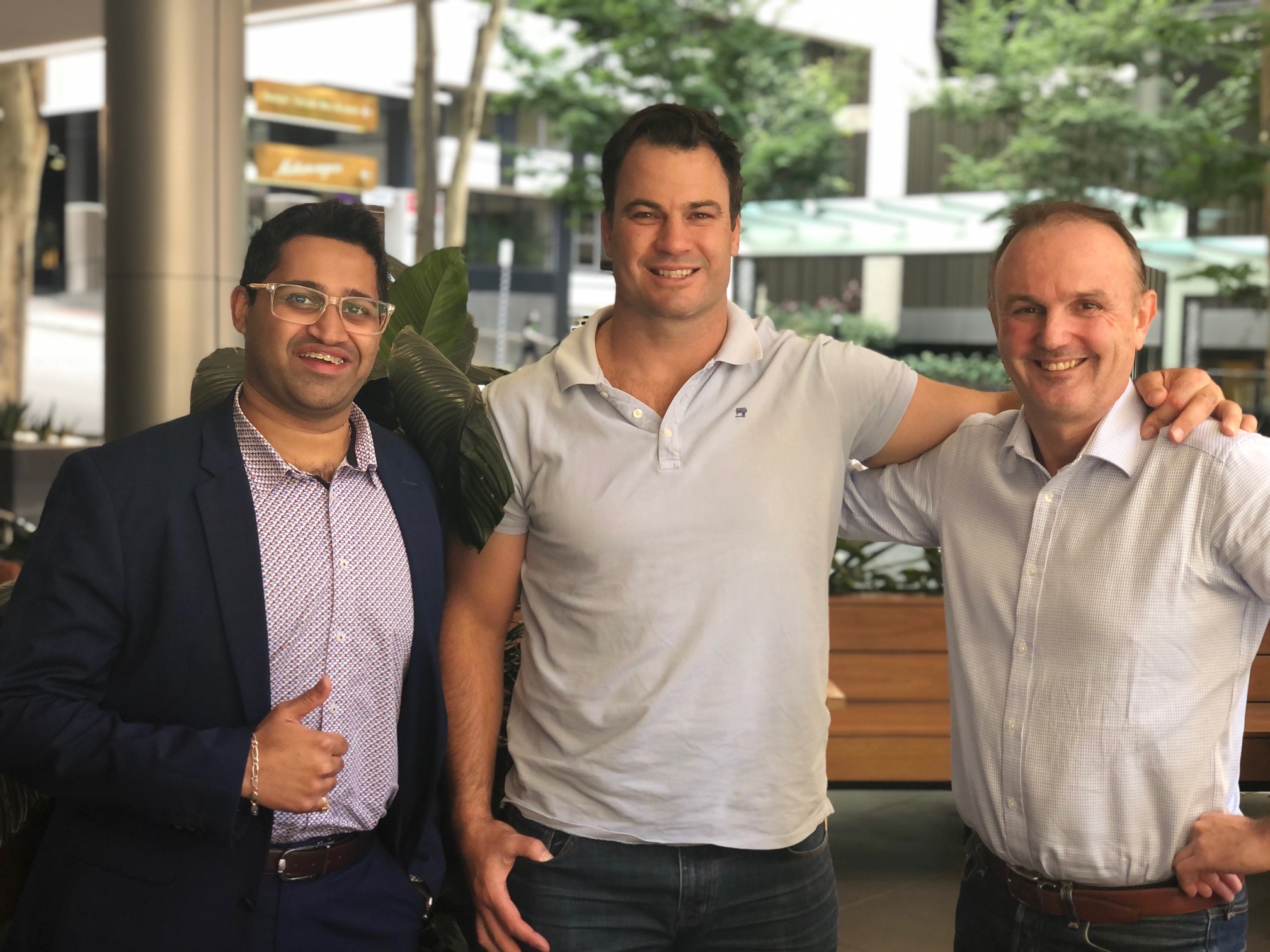 Taher Ali, David Shillington and Brenden Brien celebrating Wellbeing Code coming on board as a client with Win WIn Outcomes